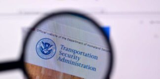 Magnifying glass focusing on the Transportation Security Administration website