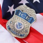 ICE officer badge resting on an American flag