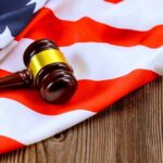 A gavel resting on an American flag