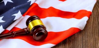 A gavel resting on an American flag