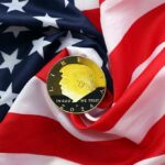 A gold coin featuring a profile and the year 2024, placed on a wrinkled American flag
