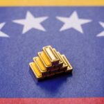 Stack of gold bars on a Venezuelan flag background