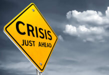 A yellow warning sign indicating a crisis ahead