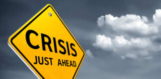 A yellow warning sign indicating a crisis ahead