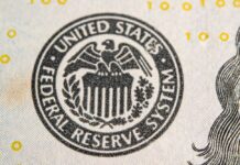 Close-up of the Federal Reserve System seal on a banknote
