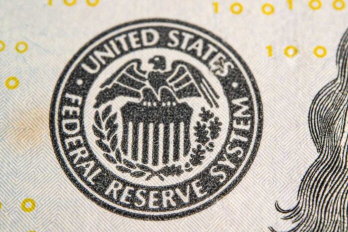 Close-up of the Federal Reserve System seal on a banknote