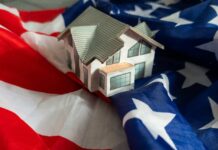 A model house placed on an American flag