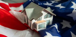 A model house placed on an American flag