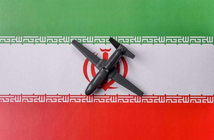 A model airplane placed on the Iranian flag