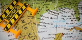 A caution sign placed on a map highlighting Mexico and the Gulf of Mexico