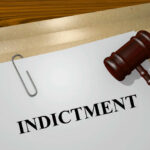 Governor INDICTED — Cartel Payroll Exposed Gavel on a white paper with the word indictment on it.
