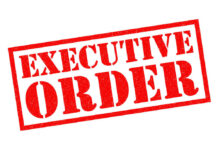 Red stamp reading executive order