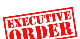 Red stamp reading executive order