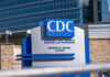 CDC building sign in front of structure.