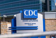 CDC building sign in front of structure.