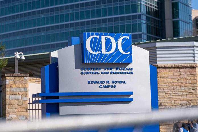 1672254097 CDC building sign in front of structure.