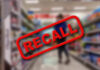 Costco Recall: Dangerous Detachments! Recall stamp on blurred store aisle background.
