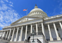 Senators Delay Pay Rule — Loophole Alert! US Capitol building with American flag and columns