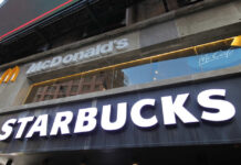 Mass Layoffs AGAIN? Starbucks’ Move Sparks Debate Signage for McDonald's and Starbucks in an urban setting