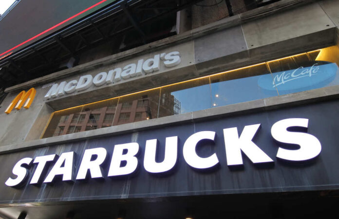 Kuala,Lumpur,Malaysia,-,November,22,,2018:,Starbuck,And,Mcdonald Signage for McDonald's and Starbucks in an urban setting