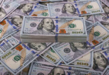 Stack of one hundred dollar bills, Benjamin Franklins portrait.