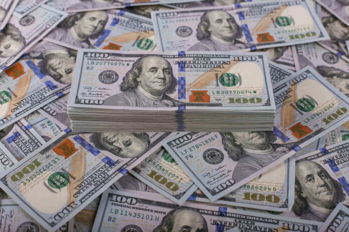 Stack of one hundred dollar bills, Benjamin Franklins portrait.