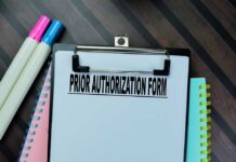 Clipboard with a prior authorization form and colorful markers