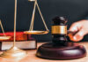 Legal Uproar: Conviction OVERTHROWN! Judge gavel, scales of justice, and law books.