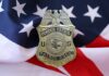 Border Patrol Shake-Up: He Quit! Border Patrol badge resting on an American flag