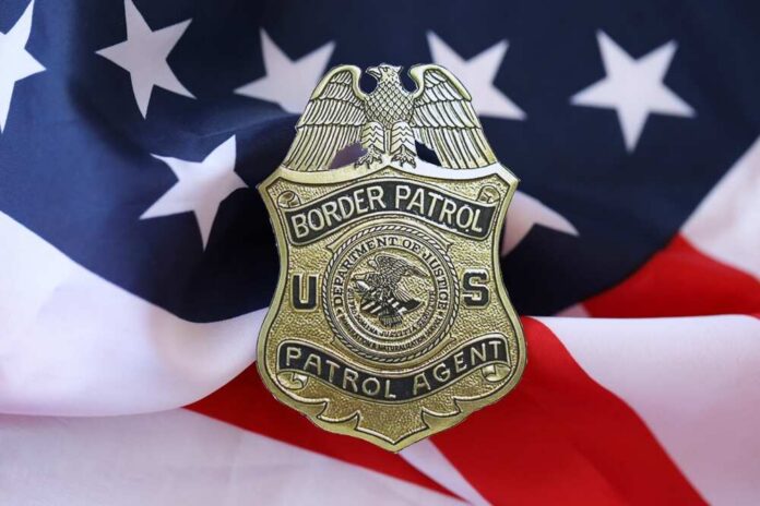 Kyiv,,Ukraine,-,March,9,,2024,Us,Border,Patrol,Agent Border Patrol badge resting on an American flag