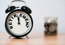 Alarm clock showing retirement and jar of coins