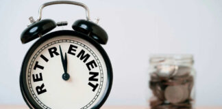 Alarm clock showing retirement and jar of coins
