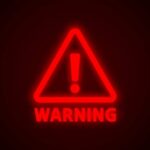 CDC Director Shrugs Off Deadly Virus Red neon warning sign with an exclamation mark