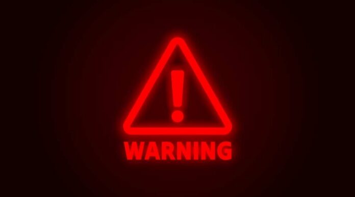 shutterstock_2575029833.jpg Red neon warning sign with an exclamation mark
