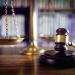 Judge’s Affair EXPOSED — Outrage Over ‘Toothless’ Reprimand Scales and gavel on a judges desk.