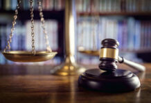 Judge’s Affair EXPOSED — Outrage Over ‘Toothless’ Reprimand Scales and gavel on a judges desk.