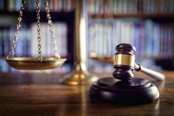 Scales and gavel on a judges desk.