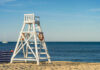 Resort Paradise Turns Predator Zone – Man Killed Lifeguard chair on sandy beach near ocean