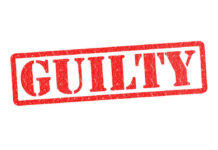 Mardi Gras Melee: Shia’s Guilty Twist Red stamp with the word guilty inside