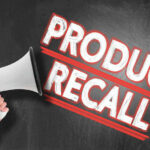 RECALL ALERT: Hidden Fire Timebomb? Megaphone and Product Recall text on chalkboard.