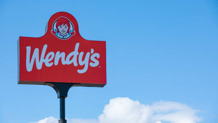 Las,Vegas,,Nv,2-13-2021:,Big,Sign,Of,Wendys,Fast,Food Wendy's restaurant sign against a clear blue sky
