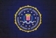 FBI Puts Most Wanted Pandemic Grifter In Handcuffs FBI logo