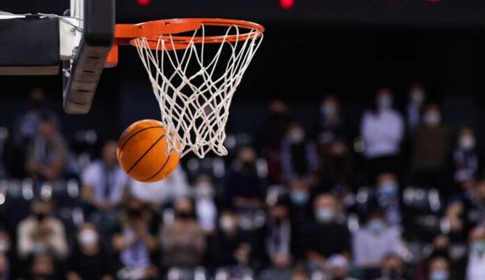 Basketball swishing through a hoop during a game