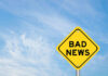 War Tax Hiding In THIS?! Yellow sign reads bad news in sky