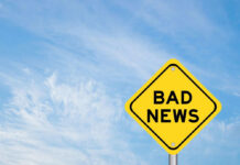 War Tax Hiding In THIS?! Yellow sign reads bad news in sky