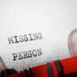 Close-up of a typewritten document with the words 'MISSING PERSON'