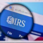 Magnifying glass focusing on the IRS website logo