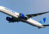 Bluetooth Name PANIC Grounds United Jet Airplane flying in clear blue sky daytime