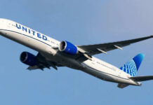 Bluetooth Name PANIC Grounds United Jet Airplane flying in clear blue sky daytime