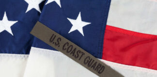 U.S. Coast Guard patch on American flag.